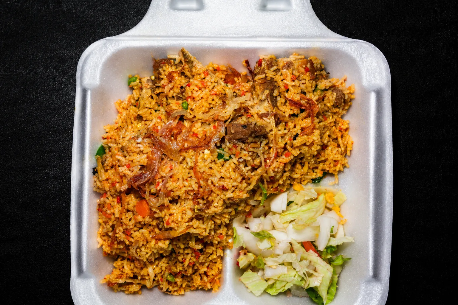 Kachchi biryani — marinated meat layered with rice