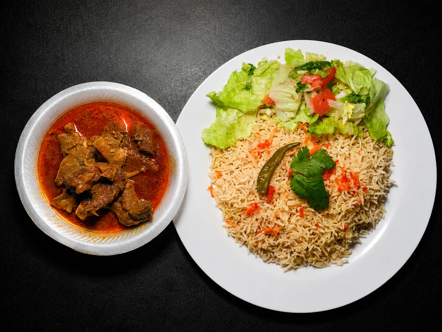 Beef curry with rice and salad