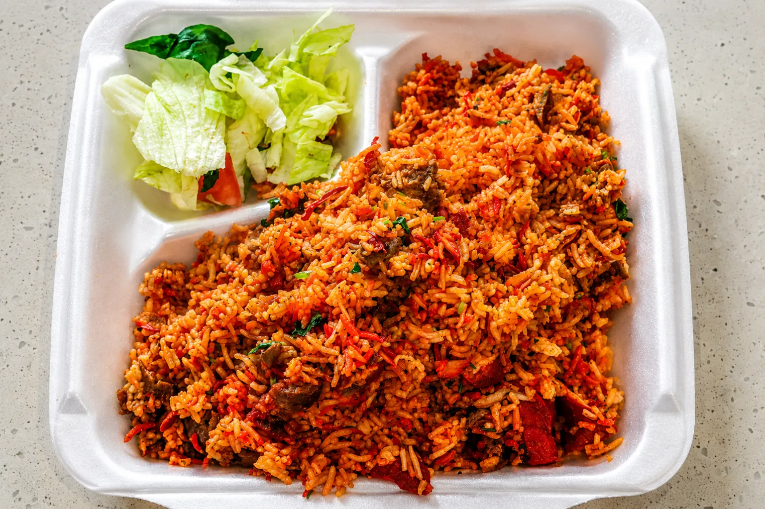 Mixed Biryani — spiced red rice with meat and green sauce