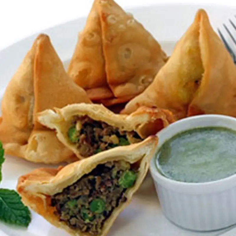Meat samosas with green chutney